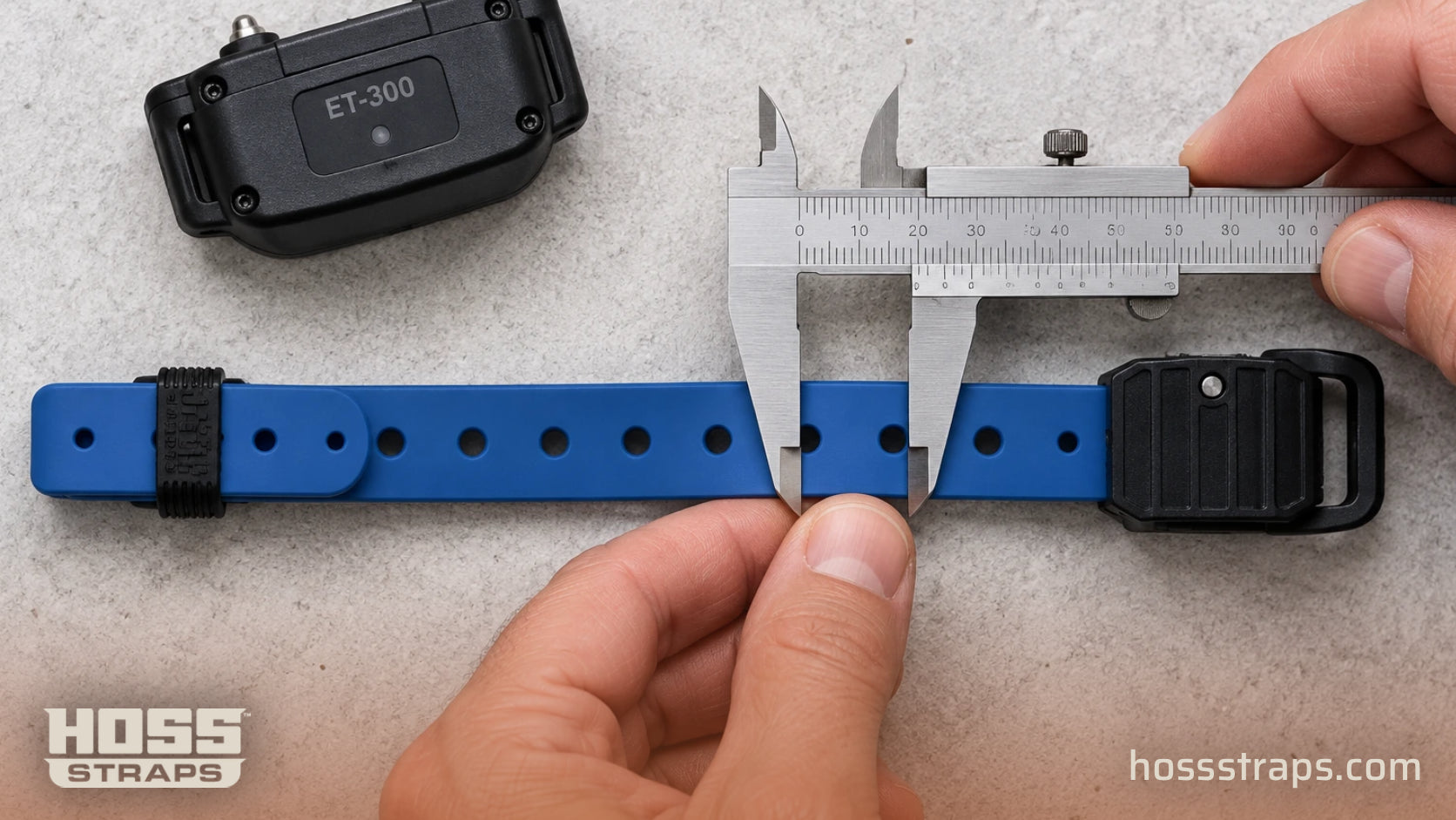 Caliper measuring the width of a cobalt blue HOSS e-collar strap beside an ET-300 receiver